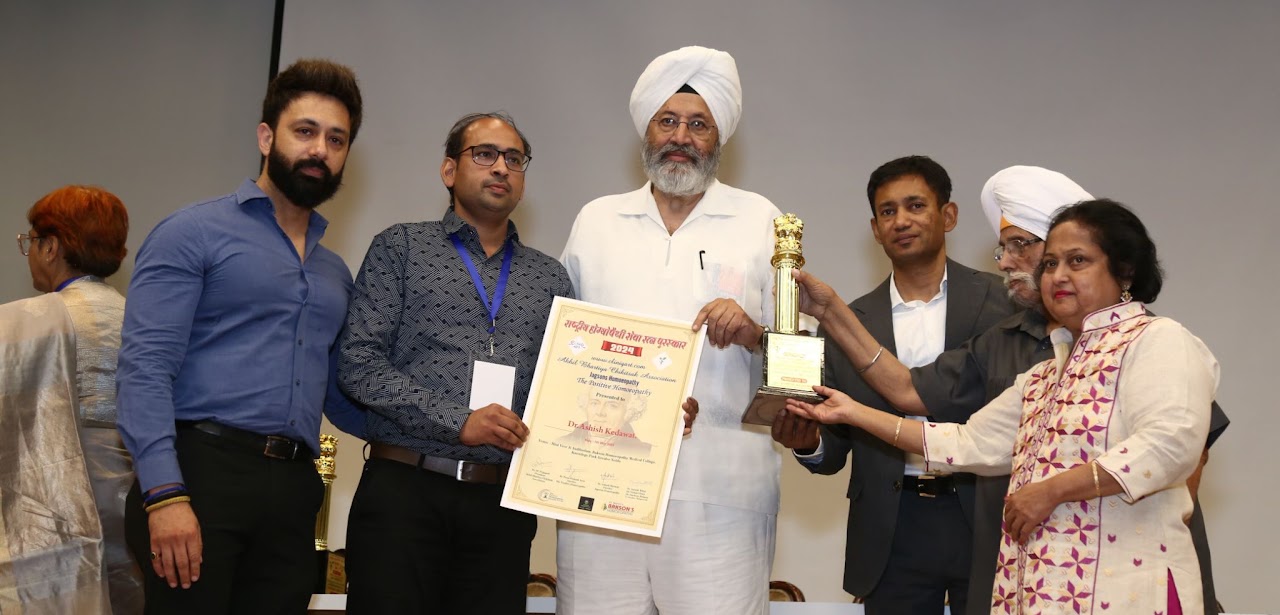 Dr. Ashish Kedawat receiving a national homoeopathy award